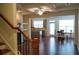 Bright and spacious living area with hardwood flooring, fireplace, and coffered ceilings at 5317 Radford Loop, Fairburn, GA 30213