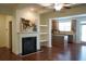 Open-concept living room featuring a fireplace and seamless flow into the modern kitchen at 5317 Radford Loop, Fairburn, GA 30213