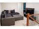 Cozy living room area with comfortable seating, large screen television, and carpet flooring at 5317 Radford Loop, Fairburn, GA 30213