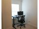 This is a well-lit office with a standing desk, computer, and comfortable office chair at 5317 Radford Loop, Fairburn, GA 30213