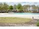 Community swimming pool with a surrounding fence at 5317 Radford Loop, Fairburn, GA 30213