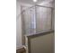 Tiled shower with glass door and granite trim at 5317 Radford Loop, Fairburn, GA 30213