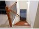 Elegant staircase with stained wood and metal spindles leading to the lower level at 5317 Radford Loop, Fairburn, GA 30213