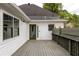Back deck of home with white siding and a green door at 290 Georgia Se Ave, Atlanta, GA 30312