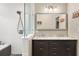 Bathroom featuring a walk-in shower, a soaking tub, double sinks, and vanity lighting at 290 Georgia Se Ave, Atlanta, GA 30312