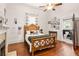 Bedroom with a wood frame bed, wood floors, a ceiling fan, and an adjoining bathroom at 290 Georgia Se Ave, Atlanta, GA 30312