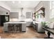 Bright kitchen featuring island with seating, subway tile backsplash, open shelving, and modern appliances at 290 Georgia Se Ave, Atlanta, GA 30312