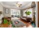 Comfortable living room with hardwood floors, leather seating, large windows, and view to the kitchen at 290 Georgia Se Ave, Atlanta, GA 30312