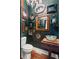 Unique powder room features a vessel sink, crystal chandelier, and gallery wall of mirrors at 290 Georgia Se Ave, Atlanta, GA 30312