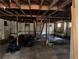 Unfinished basement with exposed ceiling, multiple windows, cinderblock walls and support beams throughout at 3008 Grand Sw Ave, Atlanta, GA 30315