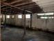 Unfinished basement with exposed ceiling beams, cinder block walls and natural light from multiple windows at 3008 Grand Sw Ave, Atlanta, GA 30315