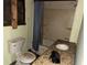 Shows a bathroom with water damage, peeling paint, and outdated fixtures at 3008 Grand Sw Ave, Atlanta, GA 30315
