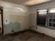 Shows an interior room with exposed pipes, water damage, and two windows at 3008 Grand Sw Ave, Atlanta, GA 30315