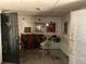 Shows an interior room with water damage, peeling paint, and a security gate at 3008 Grand Sw Ave, Atlanta, GA 30315