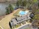 Aerial view of community pool, clubhouse, and lake with serene atmosphere at 3275 Aldrich Dr, Cumming, GA 30040