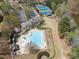 Aerial view of community pool, tennis courts and clubhouse near a lake at 3275 Aldrich Dr, Cumming, GA 30040