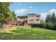 Back of house with outdoor living space, including a deck and screened porch at 3275 Aldrich Dr, Cumming, GA 30040