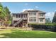 Back of house with outdoor living space, featuring a deck and screened porch at 3275 Aldrich Dr, Cumming, GA 30040