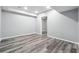 Spacious basement featuring recessed lighting and stylish gray wood-look vinyl flooring at 3275 Aldrich Dr, Cumming, GA 30040