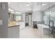 Modern bathroom featuring marble counters, dual sinks, a soaking tub, and an elegant glass shower at 3275 Aldrich Dr, Cumming, GA 30040