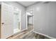 Bathroom doorway with walk-in shower, mosaic tile floor and marbled tiled walls at 3275 Aldrich Dr, Cumming, GA 30040