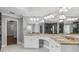 Bathroom with granite countertops, double sinks, and modern lighting fixtures, offering luxury and functionality at 3275 Aldrich Dr, Cumming, GA 30040
