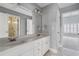 Modern bathroom featuring a double vanity with white cabinets and granite countertops at 3275 Aldrich Dr, Cumming, GA 30040