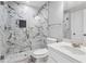 Beautiful bathroom featuring a clear glass shower with marble tile and white cabinets at 3275 Aldrich Dr, Cumming, GA 30040