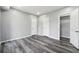 Bedroom with wood floors, neutral paint, closet and recessed lights at 3275 Aldrich Dr, Cumming, GA 30040