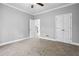 Bedroom features plush carpeting, neutral walls, and white trim around the baseboards at 3275 Aldrich Dr, Cumming, GA 30040