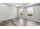 Bedroom featuring neutral paint, recessed lighting and wood floors with view of the exterior at 3275 Aldrich Dr, Cumming, GA 30040