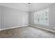 Bright bedroom featuring neutral walls, plush carpeting, and a vaulted ceiling with a fan at 3275 Aldrich Dr, Cumming, GA 30040