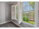 Bedroom with shuttered windows offering scenic outdoor views at 3275 Aldrich Dr, Cumming, GA 30040