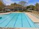 Large community pool with many lounge chairs for relaxing on a sunny day at 3275 Aldrich Dr, Cumming, GA 30040
