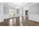 Elegant dining room with hardwood floors, plantation shutters, and detailed crown molding at 3275 Aldrich Dr, Cumming, GA 30040