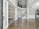 Grand entryway featuring hardwood floors, a staircase with iron railings, and an open floor plan at 3275 Aldrich Dr, Cumming, GA 30040