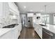 Spacious kitchen boasts marble countertops, stainless steel appliances, and ample lighting at 3275 Aldrich Dr, Cumming, GA 30040