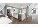 Open kitchen features a large island, stainless steel appliances, and bright lighting at 3275 Aldrich Dr, Cumming, GA 30040