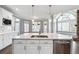 Kitchen boasts a large island, stainless steel appliances, and generous counter space at 3275 Aldrich Dr, Cumming, GA 30040