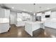 Bright kitchen features a large island, stainless appliances, and white cabinetry at 3275 Aldrich Dr, Cumming, GA 30040