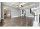 Large living room with hardwood floors, a coffered ceiling, a fireplace, and arched entryway at 3275 Aldrich Dr, Cumming, GA 30040