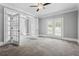 Spacious office featuring a ceiling fan, carpet floors, and French doors leading to another room at 3275 Aldrich Dr, Cumming, GA 30040