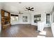 Covered patio with a stone fireplace, bar, and views of the surrounding landscape at 3275 Aldrich Dr, Cumming, GA 30040