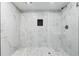 Modern walk-in shower featuring stunning marble-patterned tile at 3275 Aldrich Dr, Cumming, GA 30040