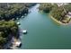 Expansive aerial view of a waterfront community showcasing the docks and serene lake at 6160 Lake Lanier Heights Rd, Buford, GA 30518
