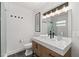 Elegant bathroom with modern vanity, black hardware, and glass enclosed shower at 6160 Lake Lanier Heights Rd, Buford, GA 30518