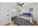 Cozy bedroom with neutral walls, hardwood floors, and lots of natural light at 6160 Lake Lanier Heights Rd, Buford, GA 30518
