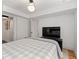 This bedroom features neutral colored walls, recessed lighting, and a television at 6160 Lake Lanier Heights Rd, Buford, GA 30518