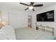 Spacious bedroom with large closet, hardwood floors, and entertainment area at 6160 Lake Lanier Heights Rd, Buford, GA 30518