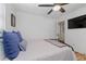 Comfortable bedroom with plush pillows, hardwood floors, and neutral walls at 6160 Lake Lanier Heights Rd, Buford, GA 30518